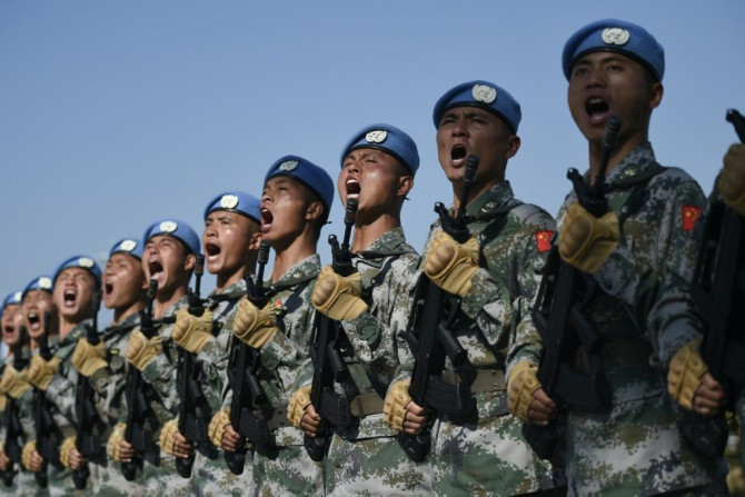 Les troupes chinoises participent à des exercices de marche avant un défilé militaire le 1er octobre pour célébrer le 70e anniversaire de la fondation de la République populaire de Chine
