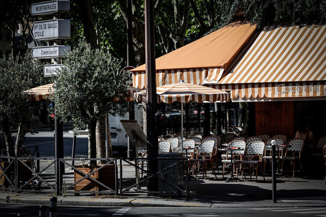 An empty café terrace in Montparnasse during a heatwave